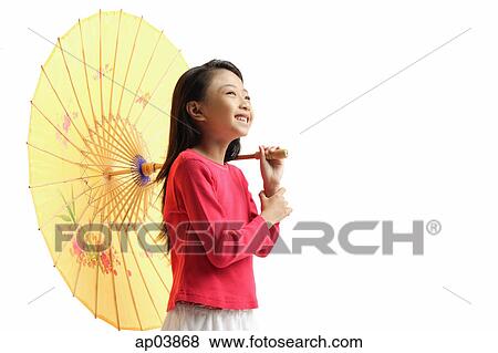 Stock Photo - Girl holding yellow umbrella, standing against white background . Fotosearch