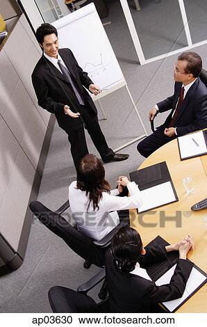 Group having a business meeting View Large Photo Image Stock Image - Group having a business meeting . Fotosearch