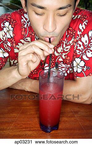 Man in floral shirt sipping drink through straw View Large Photo Image Stock Image - Man in floral shirt sipping drink through straw. Fotosearch