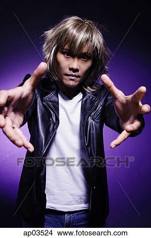 Man in leather jacket and face paint, hands reaching forward View Large Photo Image Picture - Man in leather jacket and face paint, hands reaching forward . Fotosearch
