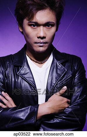 Man in leather jacket and face paint, arms crossed View Large Photo Image Stock Image - Man in leather jacket and face paint, arms crossed. Fotosearch