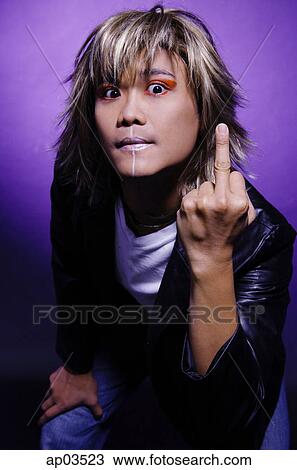 Man in leather jacket and face paint, making rude hand gesture View Large Photo Image Stock Image - Man in leather jacket and face paint, making rude hand gesture. Fotosearch