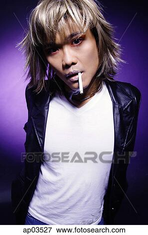 Man in leather jacket, cigarette in mouth, looking at camera View Large Photo Image Stock Photo - Man in leather jacket, cigarette in mouth, looking at camera. Fotosearch