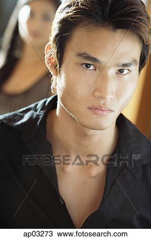 Stock Image - Man looking at camera, portrait. Fotosearch