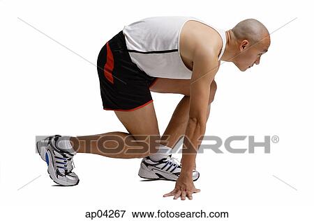 Runner in starting position, side view View Large Photo Image Stock Photo - Runner in starting position, side view . Fotosearch