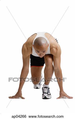 Runner in starting position View Large Photo Image Stock Photograph - Runner in starting position . Fotosearch