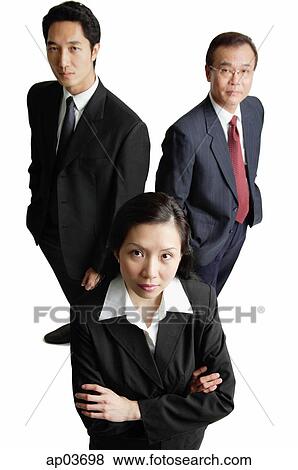 Three business people looking at camera View Large Photo Image Stock Photo - Three business people looking at camera. Fotosearch