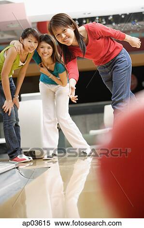 Three women at a bowling alley, bowling ball in the foreground View Large Photo Image Stock Photography - Three women at a bowling alley, bowling ball in the foreground . Fotosearch