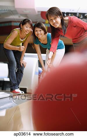 Three women at a bowling alley View Large Photo Image Picture - Three women at a bowling alley . Fotosearch