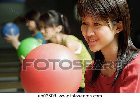 Stock Photo - Three women bowling . Fotosearch