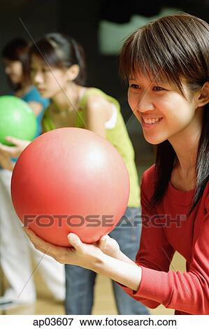 Three women with bowling balls, preparing to bowl View Large Photo Image Stock Photo - Three women with bowling balls, preparing to bowl . Fotosearch