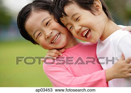 Two girls with arms around each other, laughing, portrait View Large Photo Image Stock Image - Two girls with arms around each other, laughing, portrait . Fotosearch