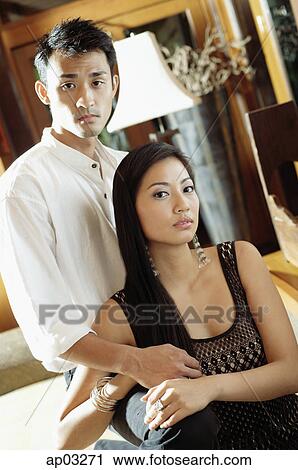 Well dressed couple, looking at camera, portrait View Large Photo Image Stock Image - Well dressed couple, looking at camera, portrait . Fotosearch