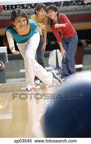 Woman bowling, friends watching View Large Photo Image Stock Photography - Woman bowling, friends watching . Fotosearch