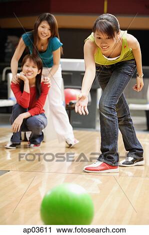 Stock Image - Woman bowling . Fotosearch