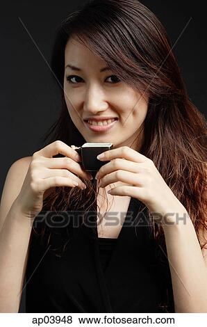 Stock Photo - Woman holding teacup. Fotosearch