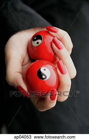 Woman holding Yin Yang balls View Large Photo Image Stock Image - Woman holding Yin Yang balls . Fotosearch