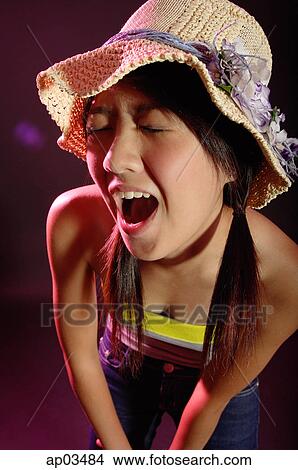 Woman in tube top and hat, shouting View Large Photo Image Picture - Woman in tube top and hat, shouting . Fotosearch