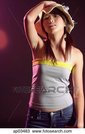 Woman in tube top and straw hat View Large Photo Image Stock Image - Woman in tube top and straw hat. Fotosearch