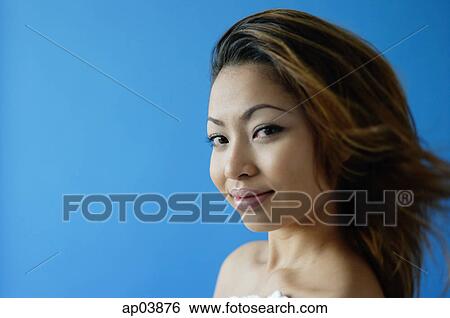 Woman looking at camera, sideways glance View Large Photo Image Stock Photograph - Woman looking at camera, sideways glance . Fotosearch