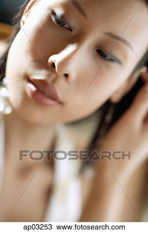 Woman looking away, head shot View Large Photo Image Stock Image - Woman looking away, head shot. Fotosearch