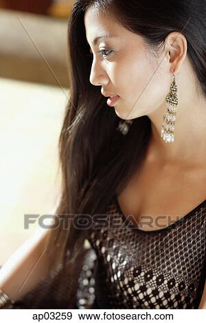 Woman looking away, side view View Large Photo Image Stock Photo - Woman looking away, side view . Fotosearch