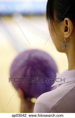 Woman preparing to bowl, over the shoulder view View Large Photo Image Stock Image - Woman preparing to bowl, over the shoulder view . Fotosearch