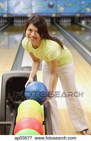 Woman selecting bowling ball View Large Photo Image Stock Photo - Woman selecting bowling ball. Fotosearch