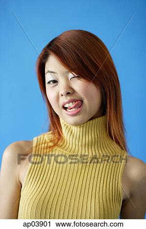 Woman wearing turtleneck, winking and sticking out tongue View Large Photo Image Stock Image - Woman wearing turtleneck, winking and sticking out tongue . Fotosearch