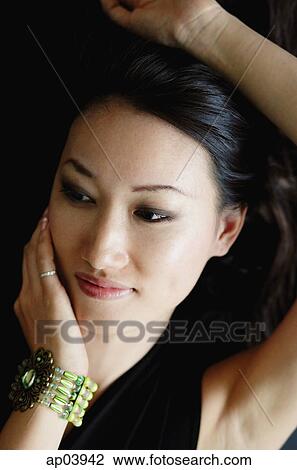 Woman with hand on face View Large Photo Image Stock Image - Woman with hand on face . Fotosearch