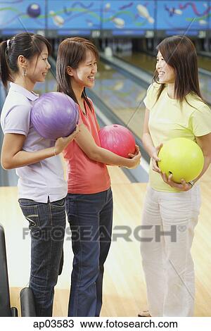 Women at bowling alley, holding bowling balls View Large Photo Image Stock Image - Women at bowling alley, holding bowling balls . Fotosearch