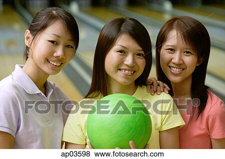 Women at bowling alley, smiling at camera View Large Photo Image Stock Photo - Women at bowling alley, smiling at camera. Fotosearch