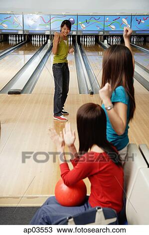 Stock Image - Women in bowling alley . Fotosearch