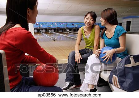 Women sitting in bowling alley View Large Photo Image Stock Photograph - Women sitting in bowling alley . Fotosearch