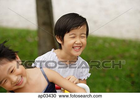 Stock Image - Young girls laughing . Fotosearch