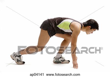 Young man at starting position, side view View Large Photo Image Stock Image - Young man at starting position, side view . Fotosearch