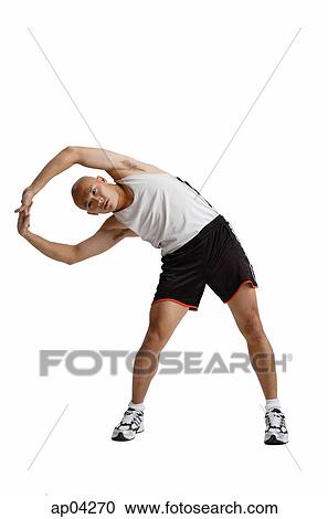 Young man doing stretching exercise View Large Photo Image Stock Image - Young man doing stretching exercise . Fotosearch
