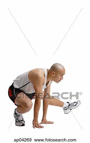 Young man doing stretching exercise View Large Photo Image Stock Photo - Young man doing stretching exercise. Fotosearch
