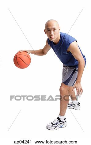 Young man dribbling basketball View Large Photo Image Stock Image - Young man dribbling basketball. Fotosearch