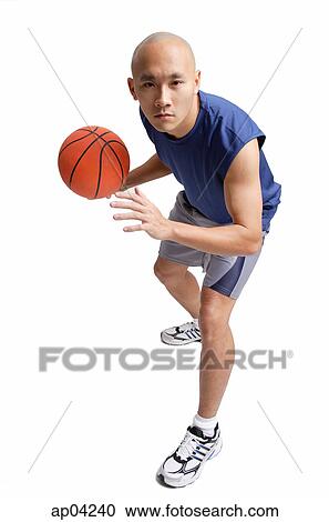 Young man holding basketball, preparing to shoot View Large Photo Image Stock Image - Young man holding basketball, preparing to shoot . Fotosearch
