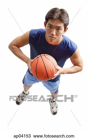 Young man holding basketball View Large Photo Image Stock Image - Young man holding basketball . Fotosearch