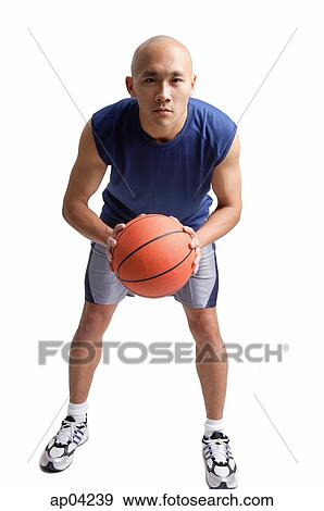 Stock Photo - Young man holding basketball . Fotosearch