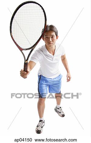 Stock Image - Young man holding tennis racket. Fotosearch
