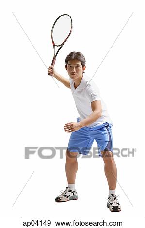 Young man holding tennis racket, waiting View Large Photo Image Stock Photo - Young man holding tennis racket, waiting . Fotosearch
