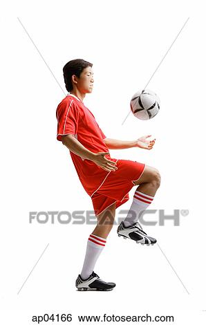 Young man in soccer uniform kneeing soccer ball View Large Photo Image Stock Photograph - Young man in soccer uniform kneeing soccer ball . Fotosearch