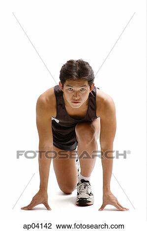 Young man in starting position, facing camera View Large Photo Image Stock Image - Young man in starting position, facing camera . Fotosearch