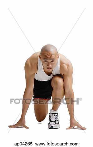Young man in starting position View Large Photo Image Stock Photography - Young man in starting position . Fotosearch