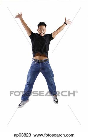 Young man jumping, arms and legs outstretched View Large Photo Image Stock Image - Young man jumping, arms and legs outstretched. Fotosearch