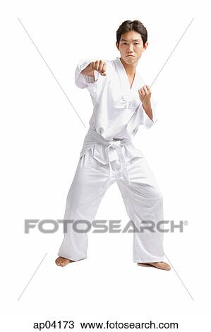 Young man practicing martial arts View Large Photo Image Stock Image - Young man practicing martial arts. Fotosearch