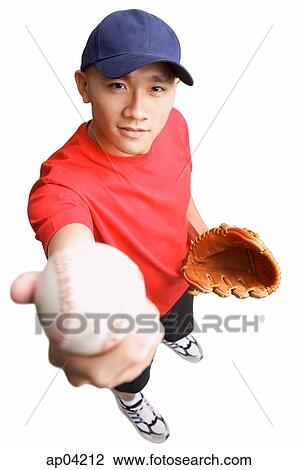 Young man wearing baseball glove and holding ball out to camera View Large Photo Image Stock Image - Young man wearing baseball glove and holding ball out to camera. Fotosearch